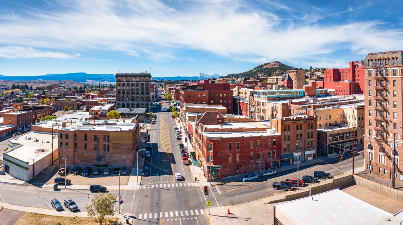 Historic Uptown Butte, Montana with iconic brick buildings and mountain backdrop